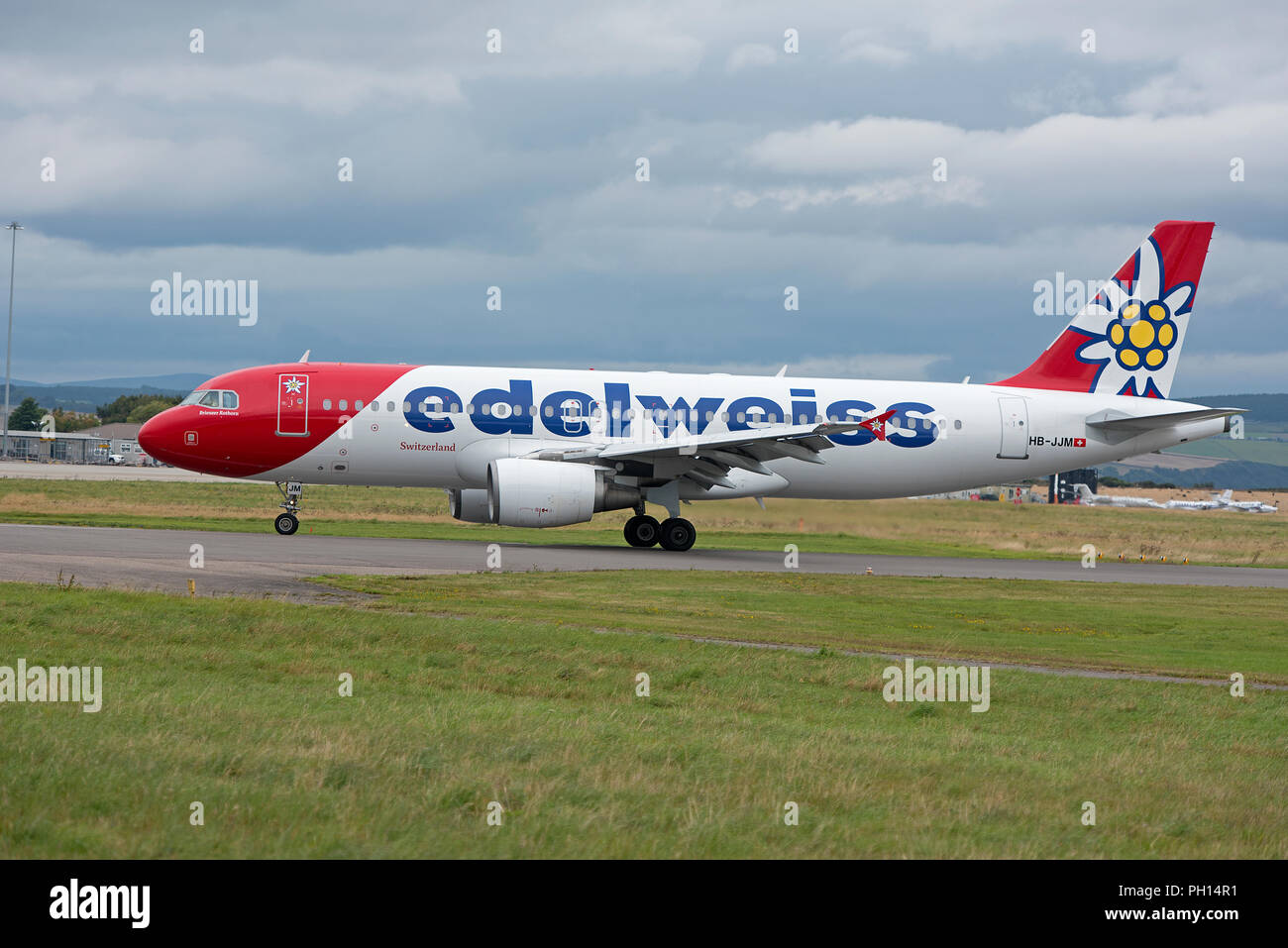 On the runway at Inverness Dalcross Airport in Scotland UK is a once weekly Summer flight from Zurich, Switzerland. Stock Photo