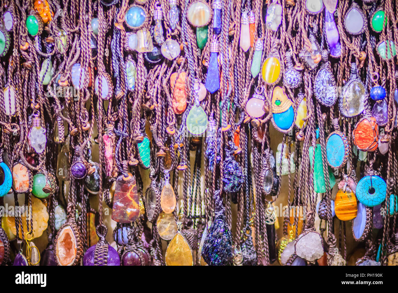 Colorful bracelets, beads and necklaces souvenir for sale on street at 