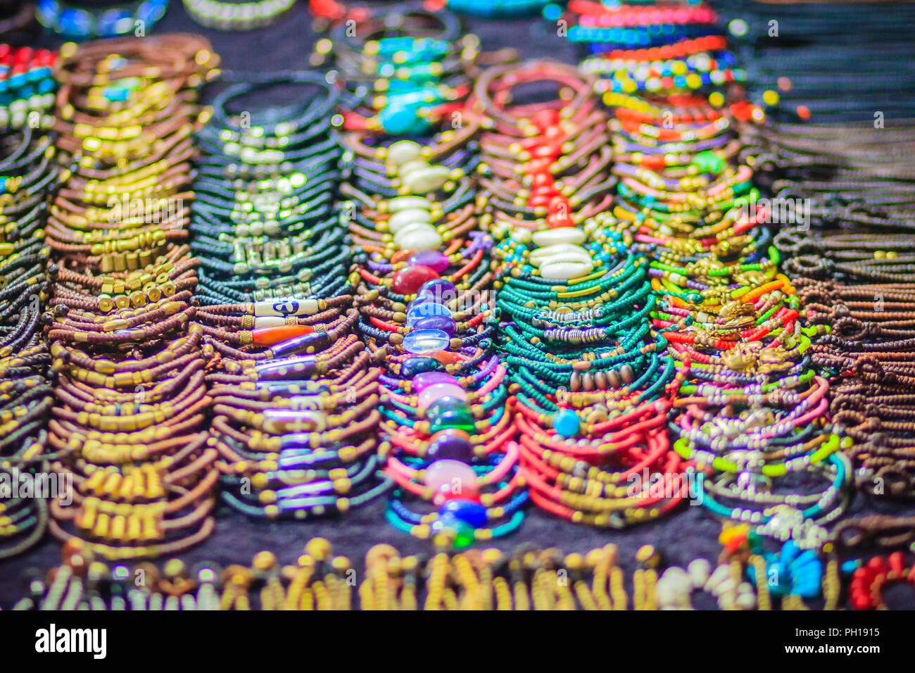 Colorful bracelets, beads and necklaces souvenir for sale on street at Khao  San Road night market, Bangkok, Thailand Stock Photo - Alamy