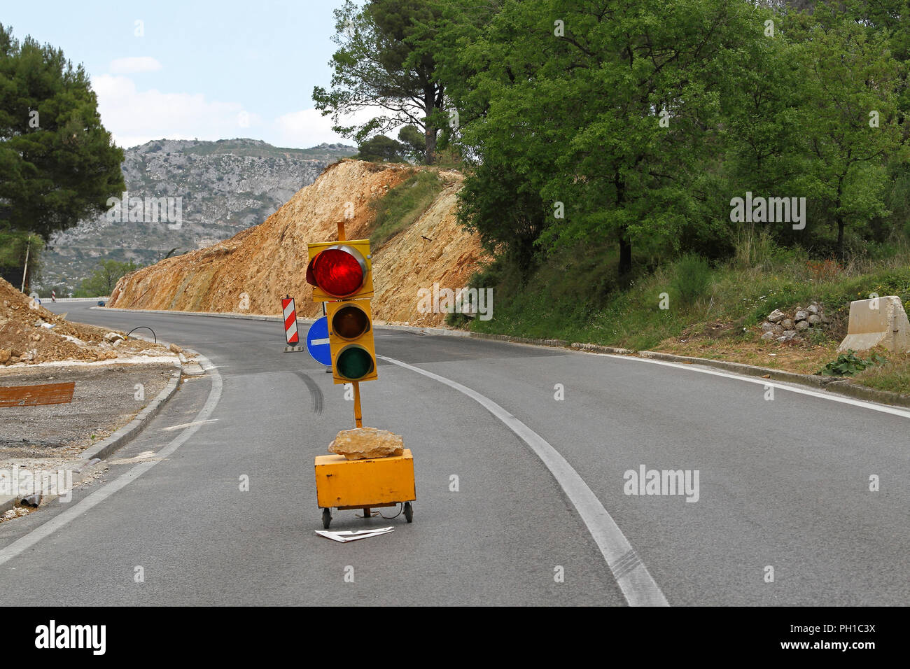 Red traffic light for road works diversion Stock Photo - Alamy