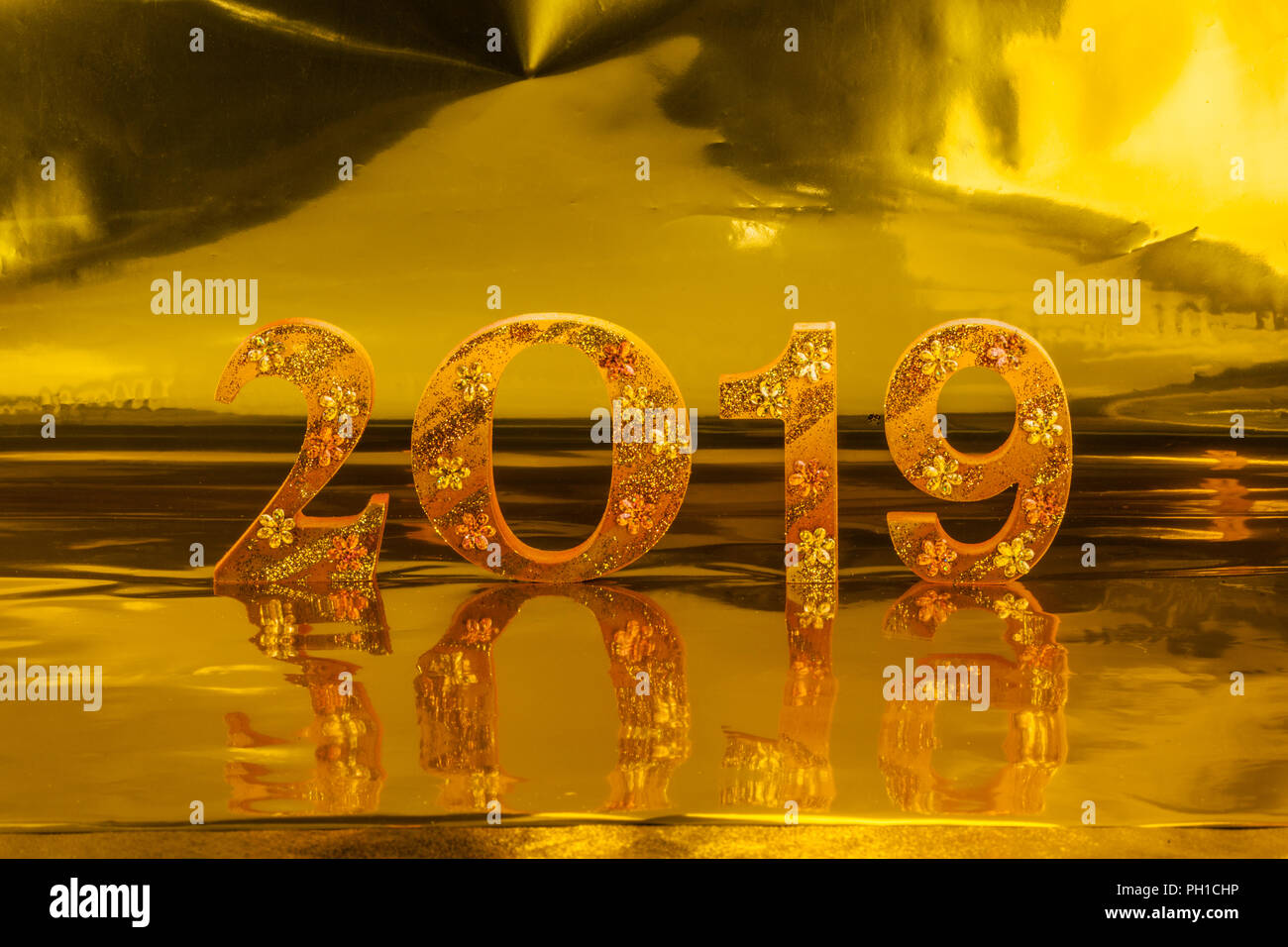 2019 is made in gold color place in golden background is mean the golden year for lucky all year Stock Photo