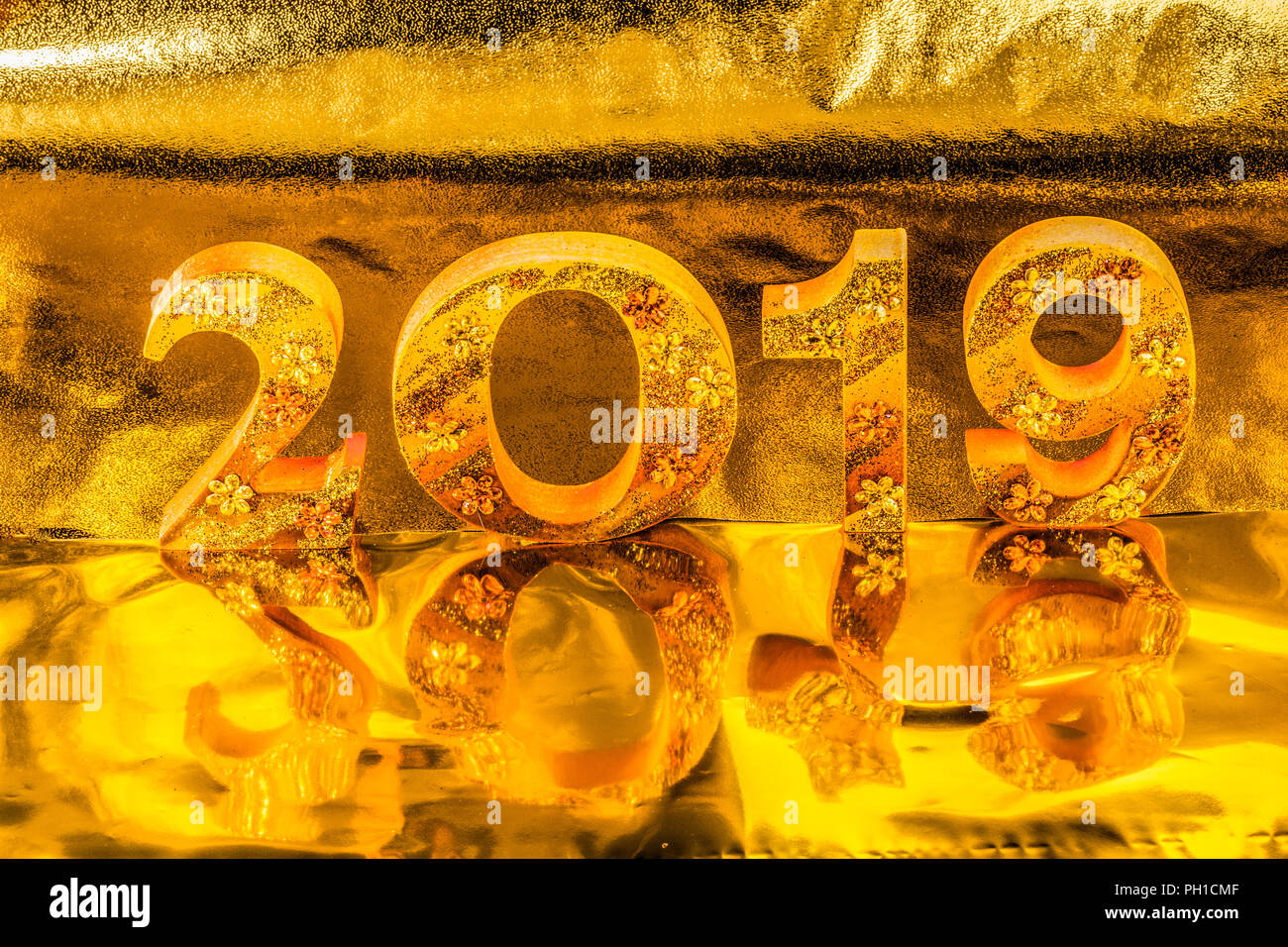 2019 is made in gold color place in golden background is mean the golden year for lucky all year Stock Photo