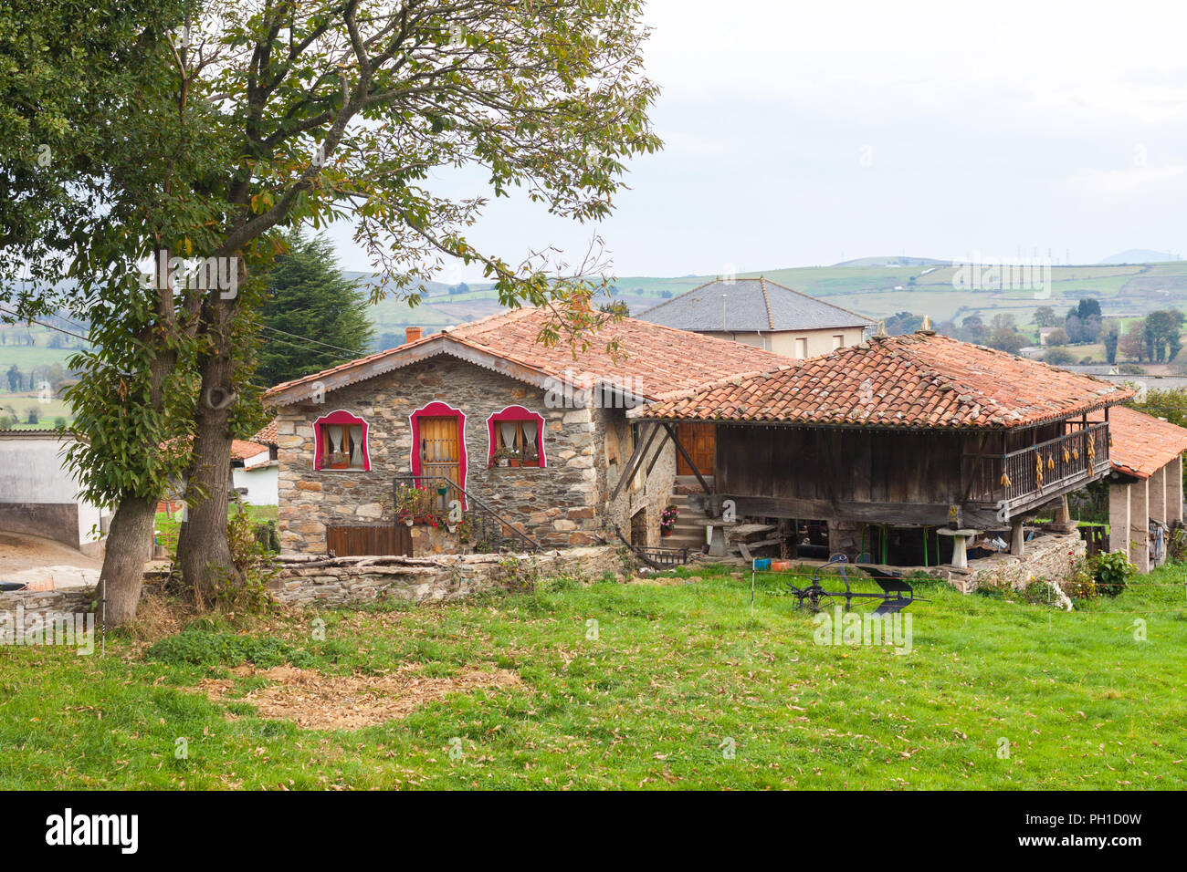 House with a typical granary, horreo, in Tineo. Asturias, Spain Stock Photo