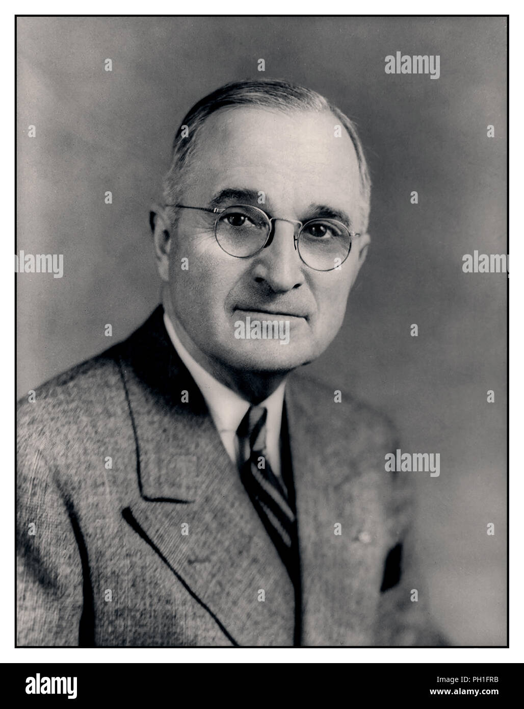 Vintage formal portrait of Democrat Harry S. Truman the 33rd President of the United States, taking office upon the death of Franklin D. Roosevelt. A World War I veteran, he assumed the presidency during the waning months of World War II and the beginning of the Cold War. Stock Photo