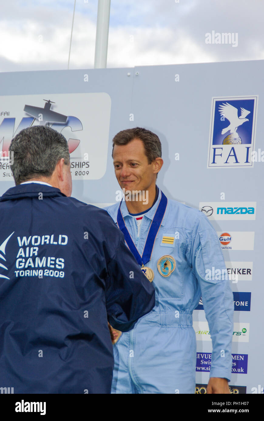 Francois Le Vot on the podium receiving medal at the World Aerobatic