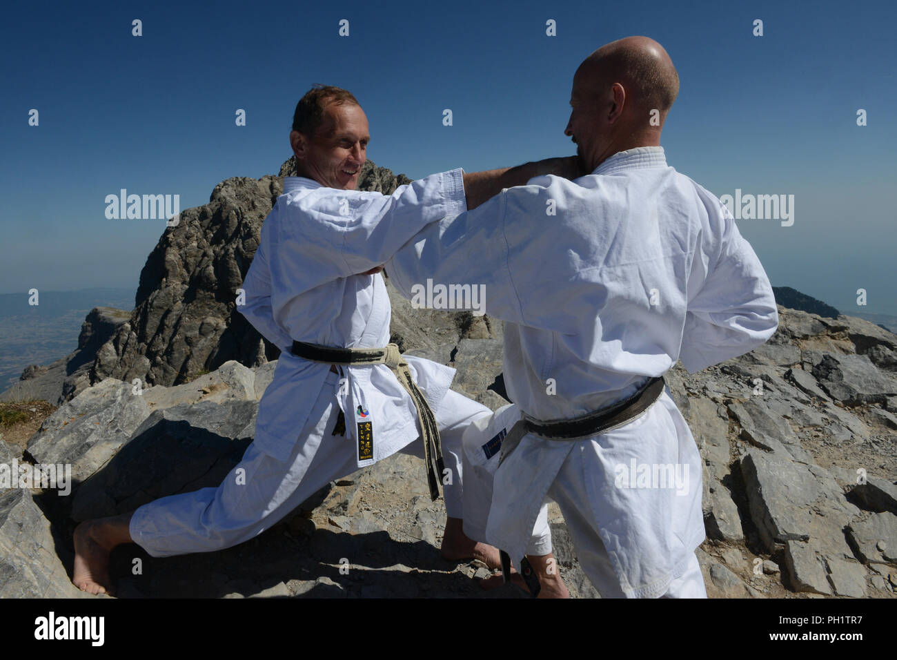 Karate performance in front of the peak of Mount Olymp, Green Stock Photo
