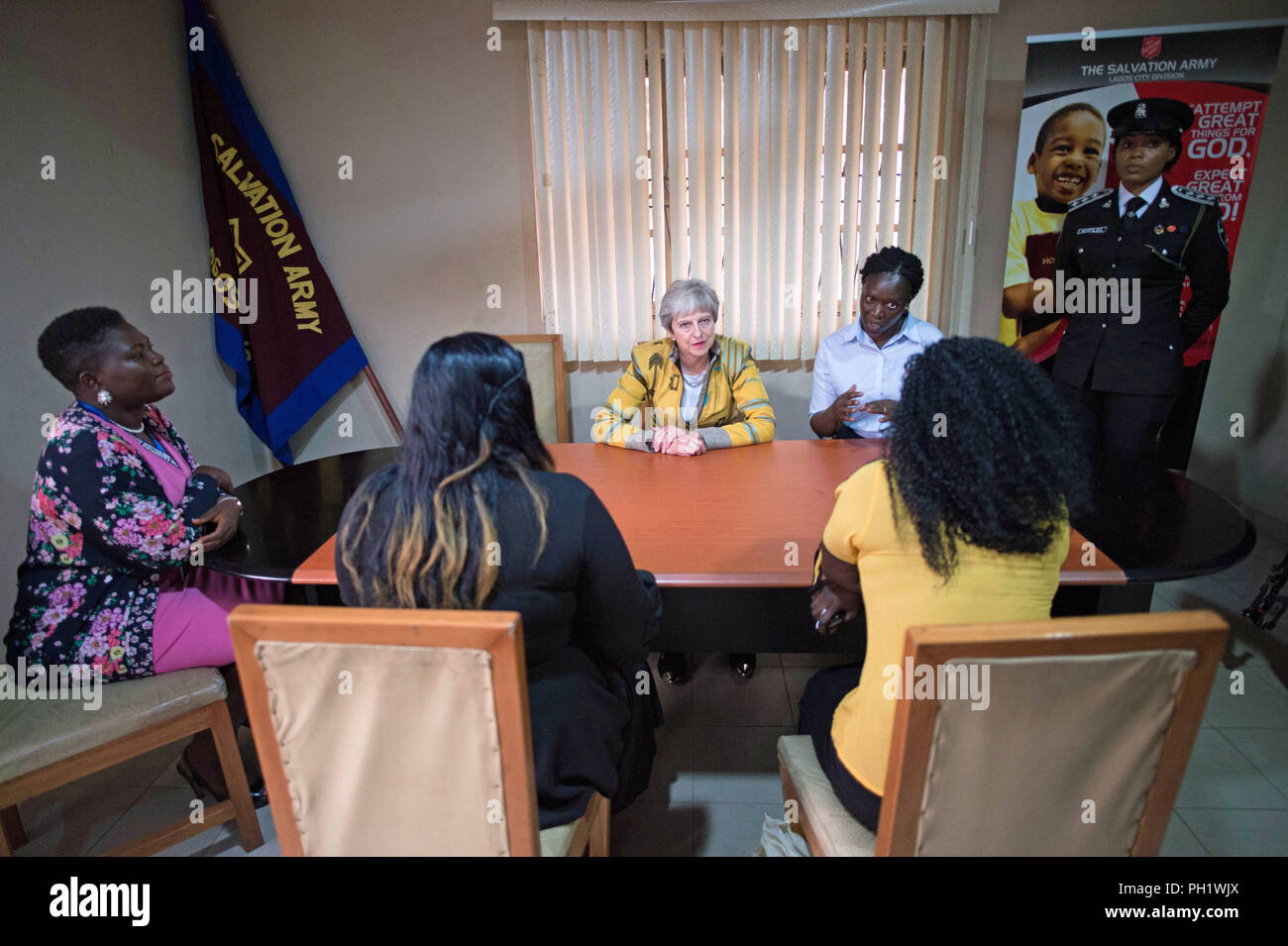 Prime Minister Theresa May meets two victims of modern slavery (identity protected) at a Salvation Army centre in Lagos, where she discussed modern slavery and saw the work they are doing to make Nigerians more aware of the threats of slavery, on day two of her trip to Africa. Stock Photo