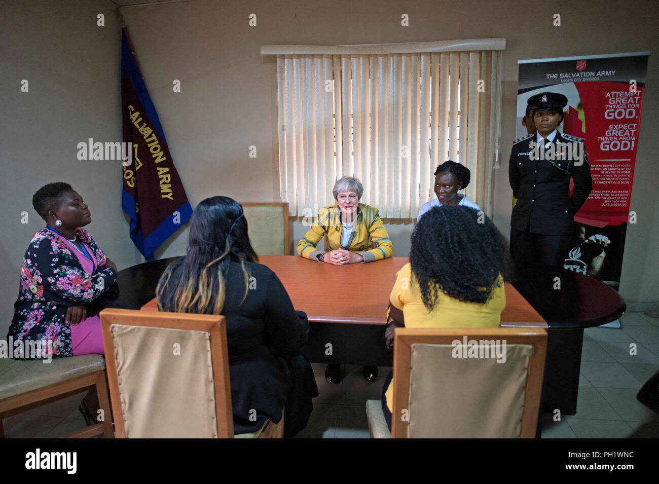 Prime Minister Theresa May meets two victims of modern slavery (identity protected) at a Salvation Army centre in Lagos, where she discussed modern slavery and saw the work they are doing to make Nigerians more aware of the threats of slavery, on day two of her trip to Africa. Stock Photo