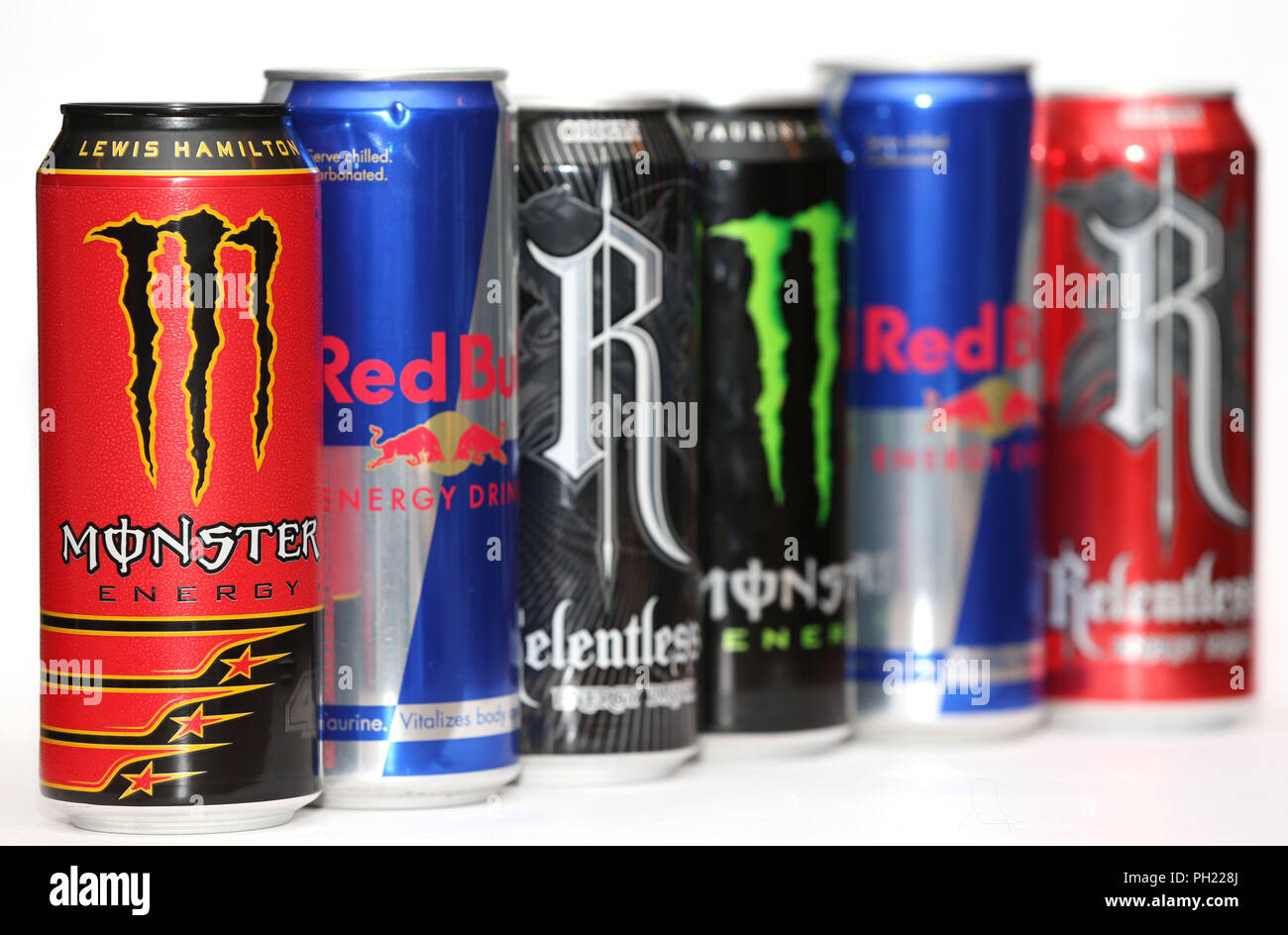 Cans of Red Bull, Monster and Relentless energy drinks. Children in England are to be from buying energy drinks under Government plans Photo - Alamy