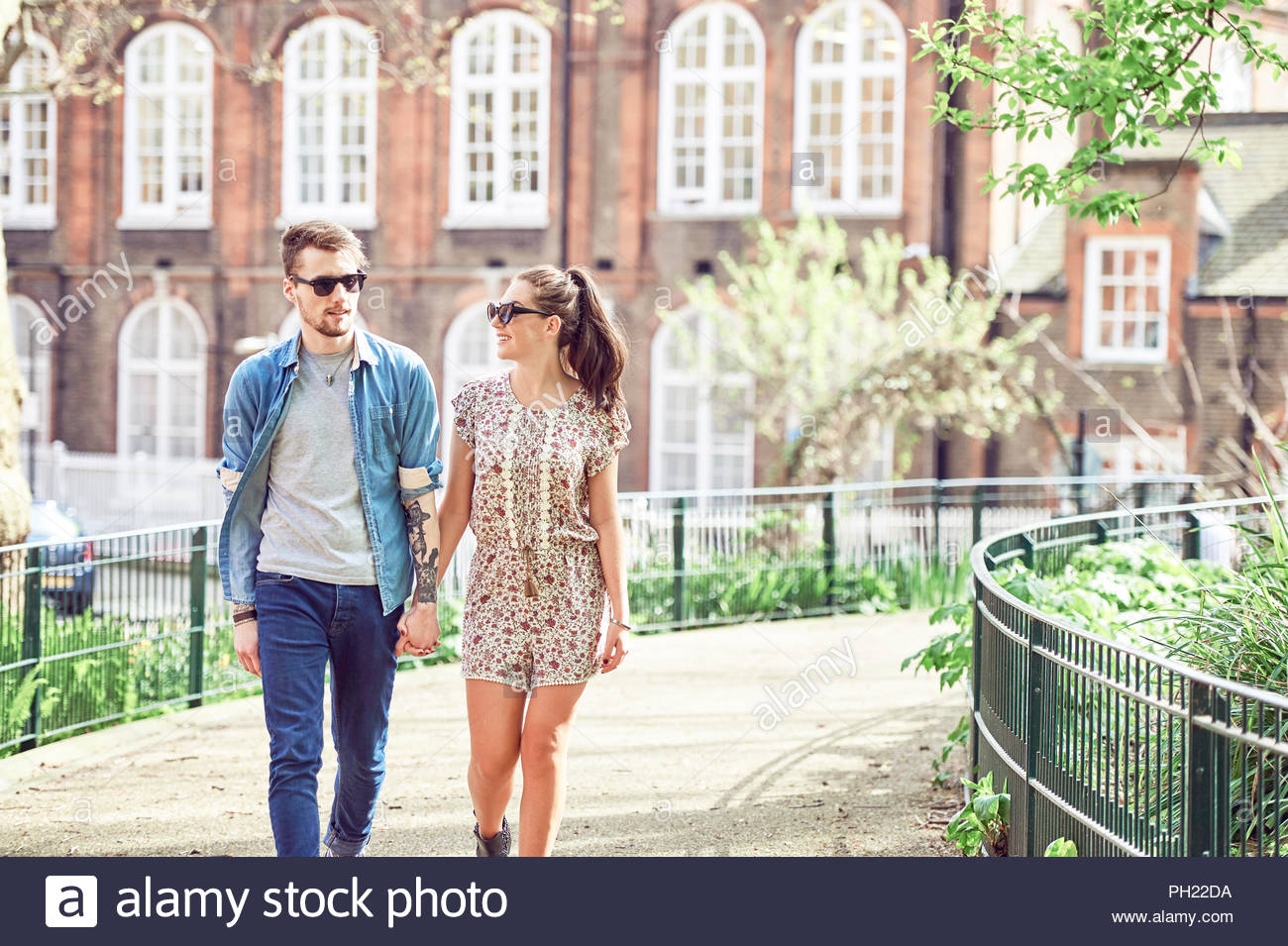 Teen Couple Walking Holding Hands High Resolution Stock Photography and ...