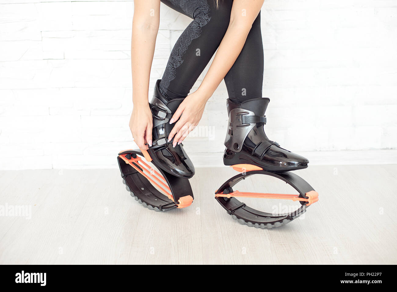 close up in kangoo jumps boots indoors unrecognizable rear view