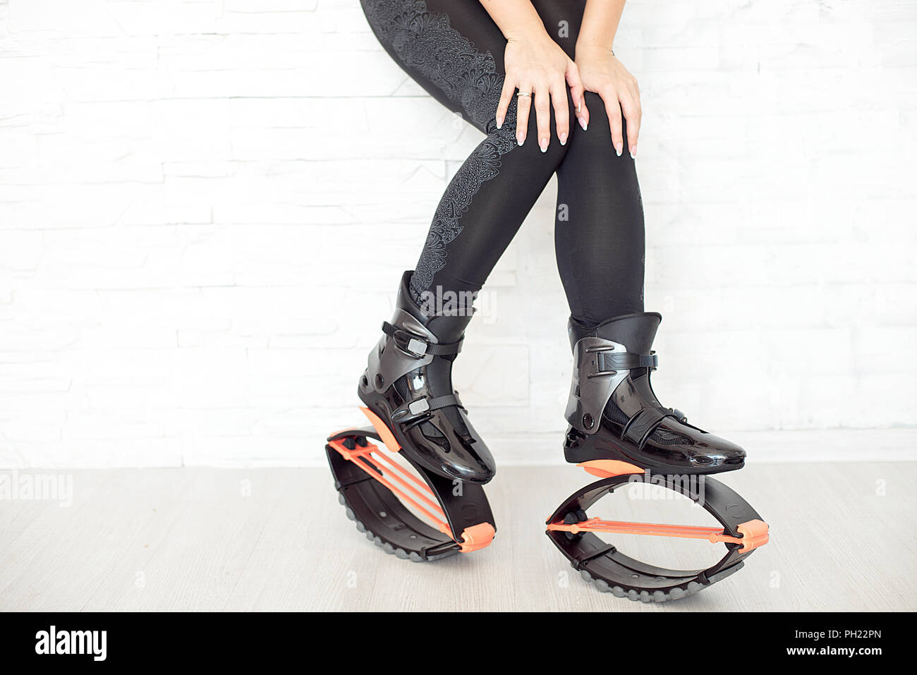 close-up in kangoo jumps boots indoors unrecognizable rear view Stock Photo  - Alamy