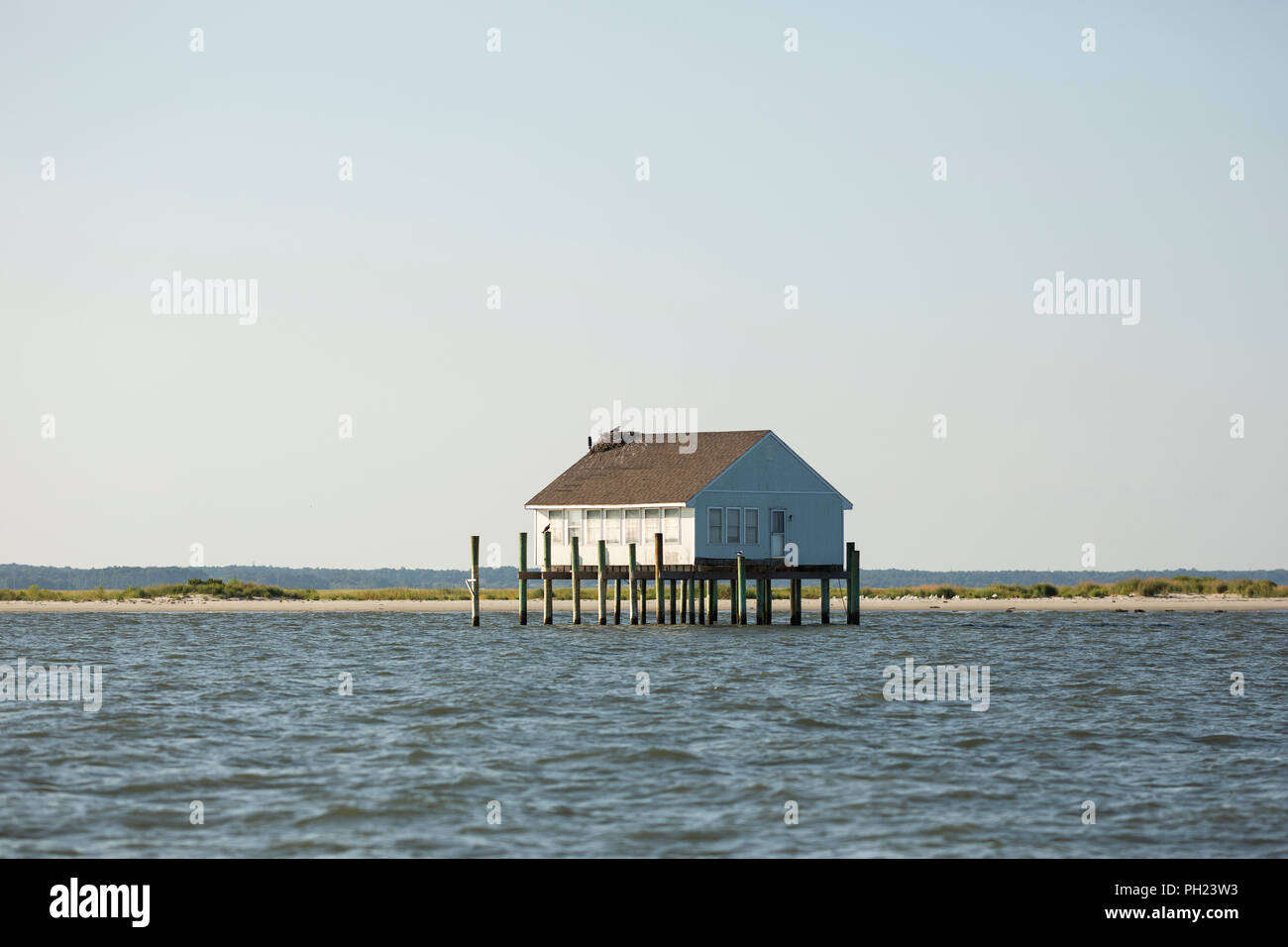 A Cabin On Stilts In The Waters Off Chincoteague Island Virginia