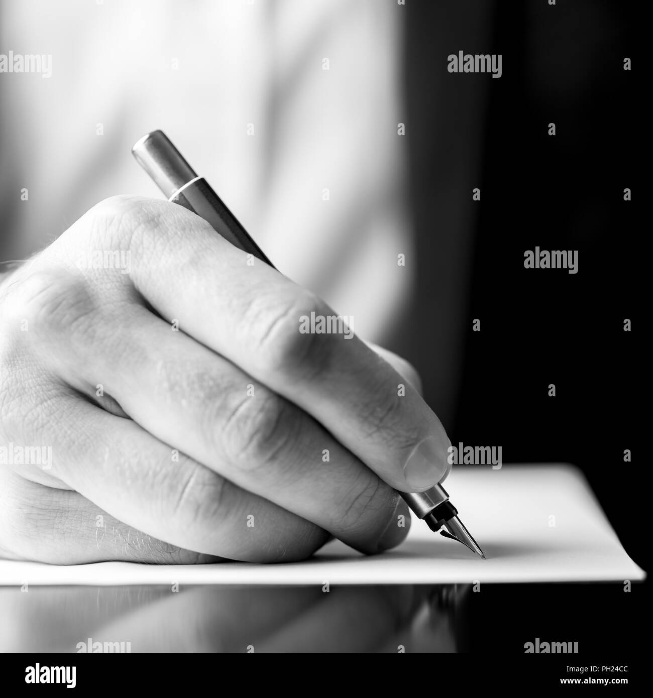 Businessman hand writing letter in Black and White Stock Photos ...