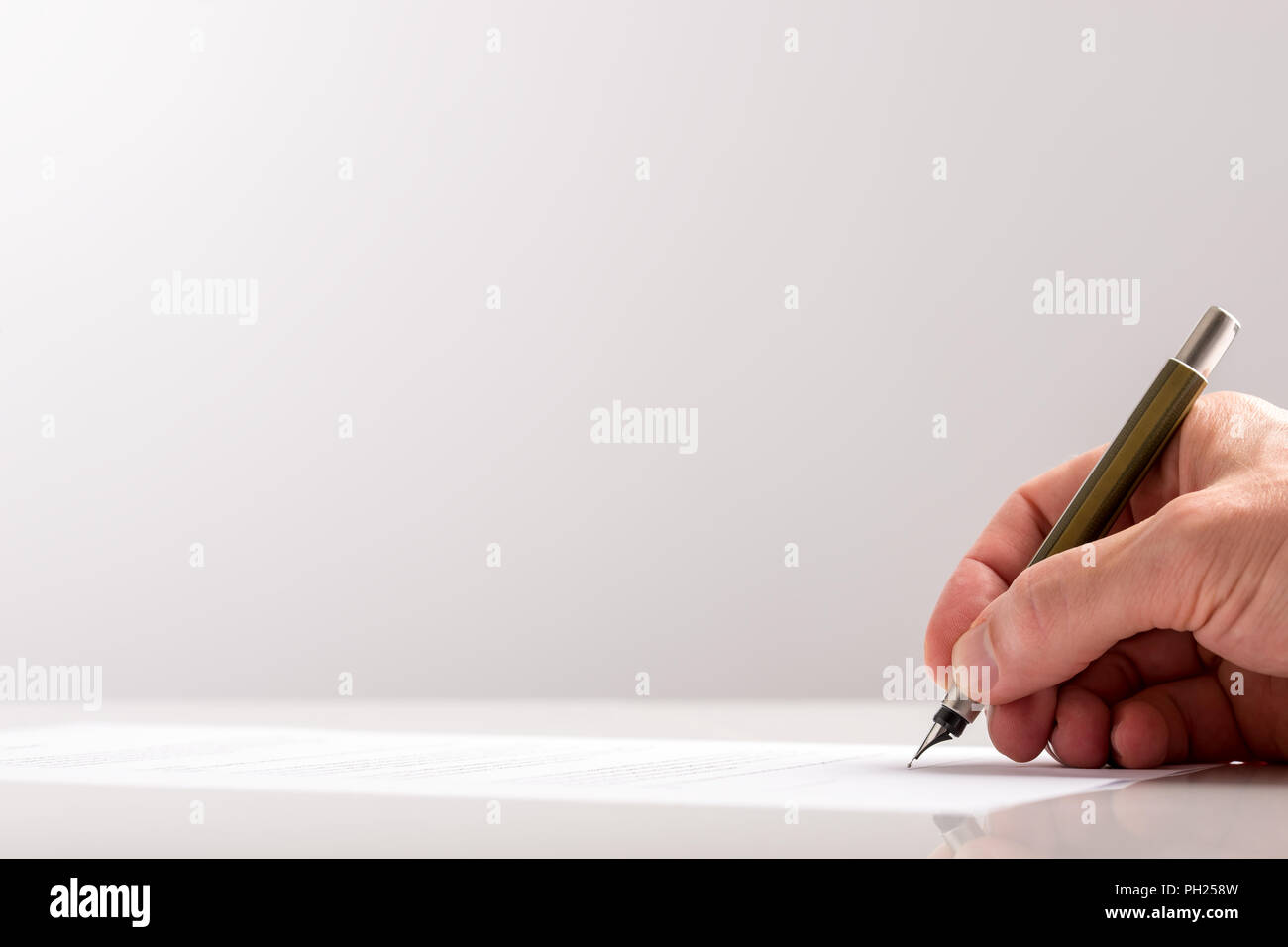 Hand Writing on White Paper at the Table Using Classic Fountain Pen ...
