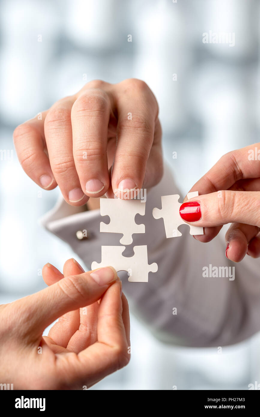 Close up Shot of Conceptual Human Hand Holding White Puzzle Pieces ...