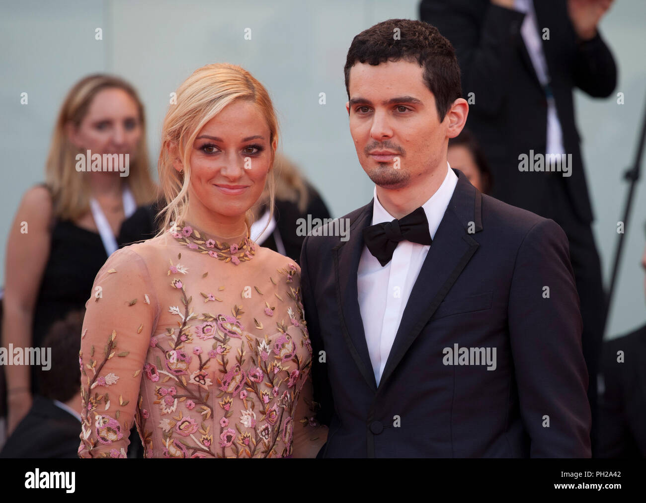 Venice, Italy. 29th Aug 2018. Actress Olivia Hamilton and director Damien Chazelle at the First Man Premiere, Opening Ceremony and Lifetime Achievement Award To Vanessa Redgrave at the 75th Venice Film Festival, Sala Grande on Wednesday 29th August 2018, Venice Lido, Italy. Credit: Doreen Kennedy/Alamy Live News Stock Photo