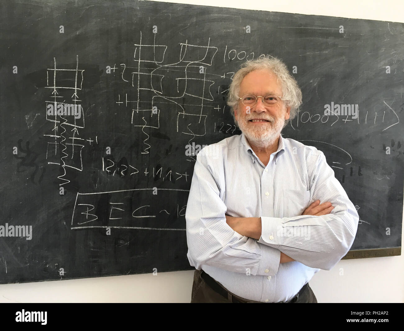 Viena, Austria. 02nd July, 2018. 02.07.2018, Austria, Vienna: The Austrian quantum physicist Anton Zeilinger stands in his office at the Institute of Quantum Optics and Quantum Information (IQOQI) of the Austrian Academy of Sciences (ÖAW). Zeilinger is one of the world's leading minds working on a completely new way of transmitting information by means of a "spooky remote effect". 0, Credit: Matthias Röder/dpa/Alamy Live News Stock Photo