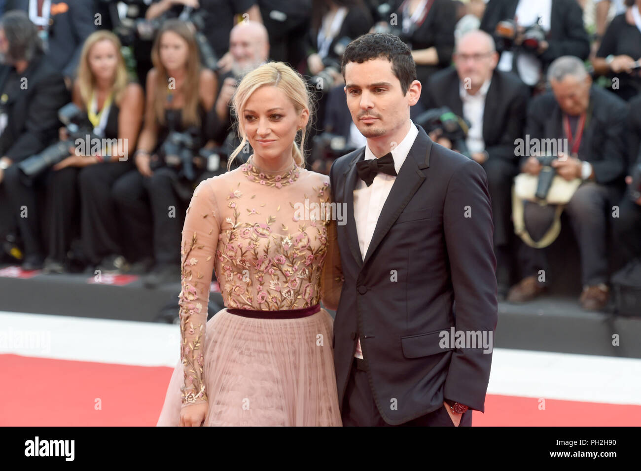 29.08.2018, Italy, Venice: The actress Olivia Hamilton and the screenwriter Damien Chazelle can be seen at the opening of the film festival on the red carpet at the Lido. The film festival runs from 29 August to 8 September and is taking place for the 75th time this year. Photo: Felix Hörhager/dpa Stock Photo