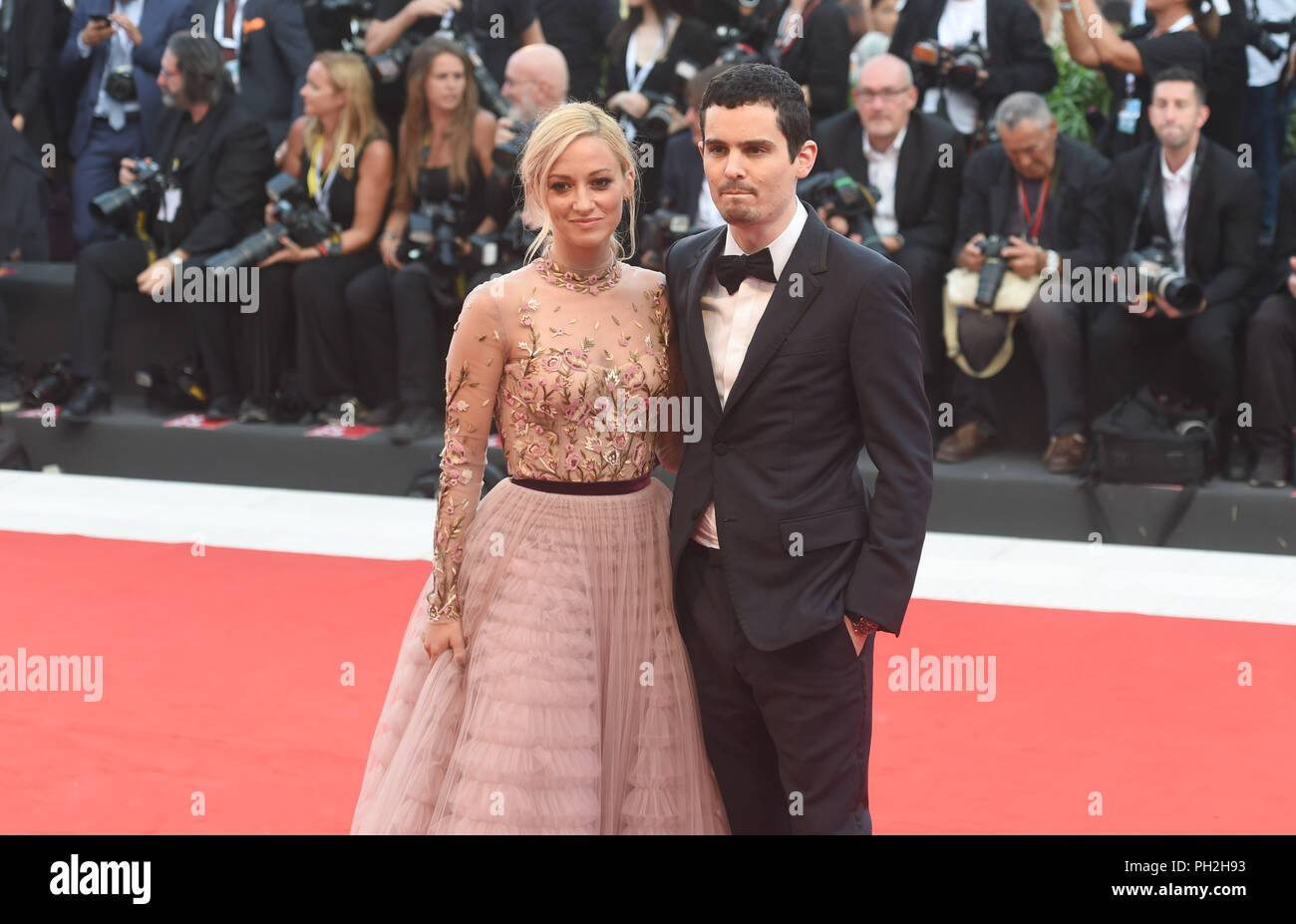 29.08.2018, Italy, Venice: The actress Olivia Hamilton and the screenwriter Damien Chazelle can be seen at the opening of the film festival on the red carpet at the Lido. The film festival runs from 29 August to 8 September and is taking place for the 75th time this year. Photo: Felix Hörhager/dpa Stock Photo