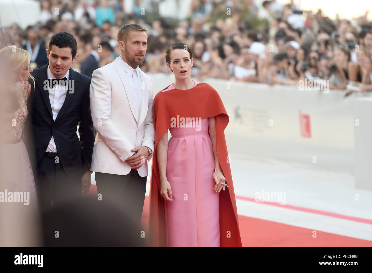 29.08.2018, Italy, Venice: The actress Olivia Hamilton, (l-r) the screenwriter Damien Chazelle and the actors Ryan Gosling and Claire Foy can be seen at the opening of the film festival at the red carpet at the Lido. The film festival runs from 29 August to 8 September and is taking place for the 75th time this year. Photo: Felix Hörhager/dpa Stock Photo