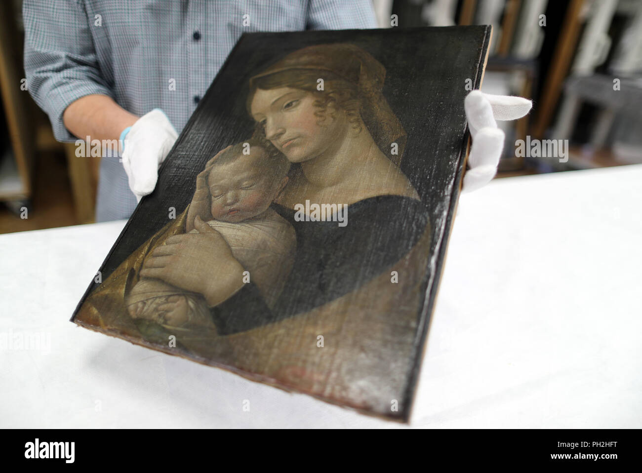 30.08.2018, Berlin: Andrea Mantegna's painting 'Maria mit schlafendem Kind' (1455) is prepared for transport to London in the depot of the National Museums in Berlin. An exhibition shown in Berlin and London is dedicated to the work of the two Renaissance artists Giovanni Bellini (c. 1435-1516) and Andrea Mantegna (c. 1431-1506). For the show, the National Museums in Berlin and the National Gallery in London are cooperating with the British Museum. Photo: Jens Büttner/dpa-Zentralbild/dpa Stock Photo
