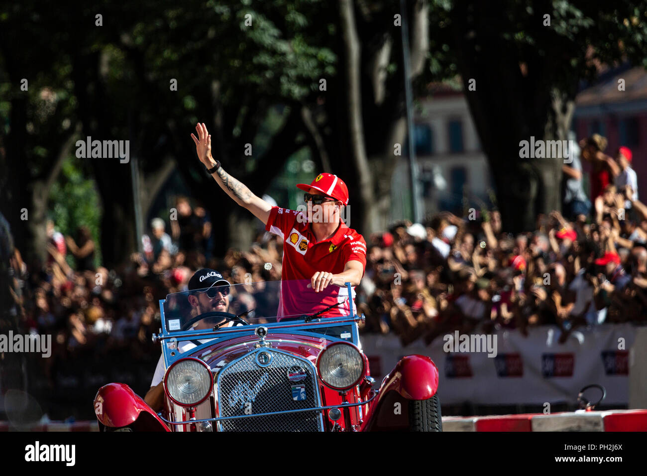 Milan, Italy, 29th August 2018 - Kimi Raikkonen from Ferrari F1 Team greets the fans during the Divers Parade at F1 Milan Festival - Valeria Portinari Alamy Live News Stock Photo