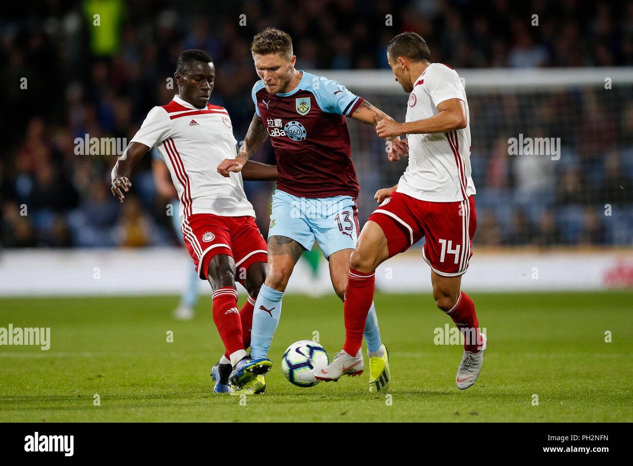 Burnley, UK. 30th August 2018. Mady Camara of Olympiakos, Jeff Hendrick of  Burnley and Omar Elabdellaoui of Olympiakos during the UEFA Europa League  Play-Off Round second leg match between Burnley and Olympiakos