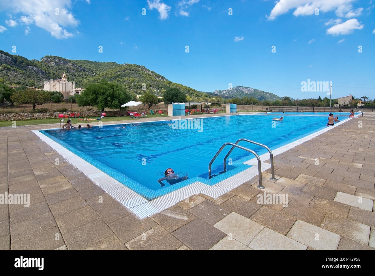 MALLORCA, SPAIN AUGUST 22, 2018 Swimming pool in Caimari on a sunny