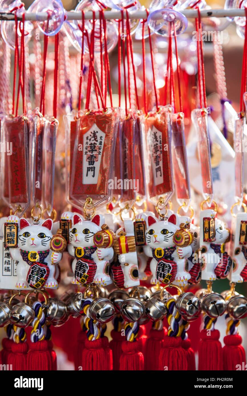 Bunch of traditional Japanese Manekineko fortune cat talismans, Nakamise shopping street, Asakusa, Tokyo, Japan, November 10, 2017. () Stock Photo