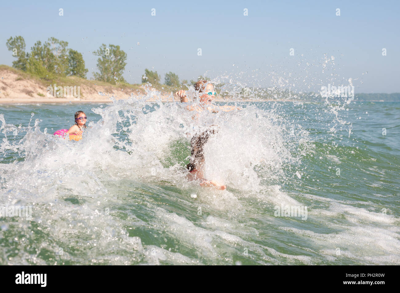 Kids swimming in Lake Ontario, Sandbanks Provincial Park, PEC Stock Photo