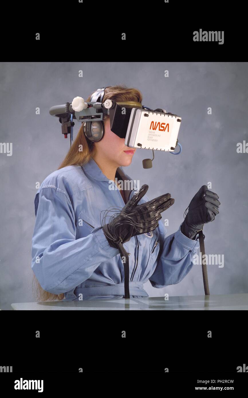 Female astronaut using virtual reality training equipment to simulate ...