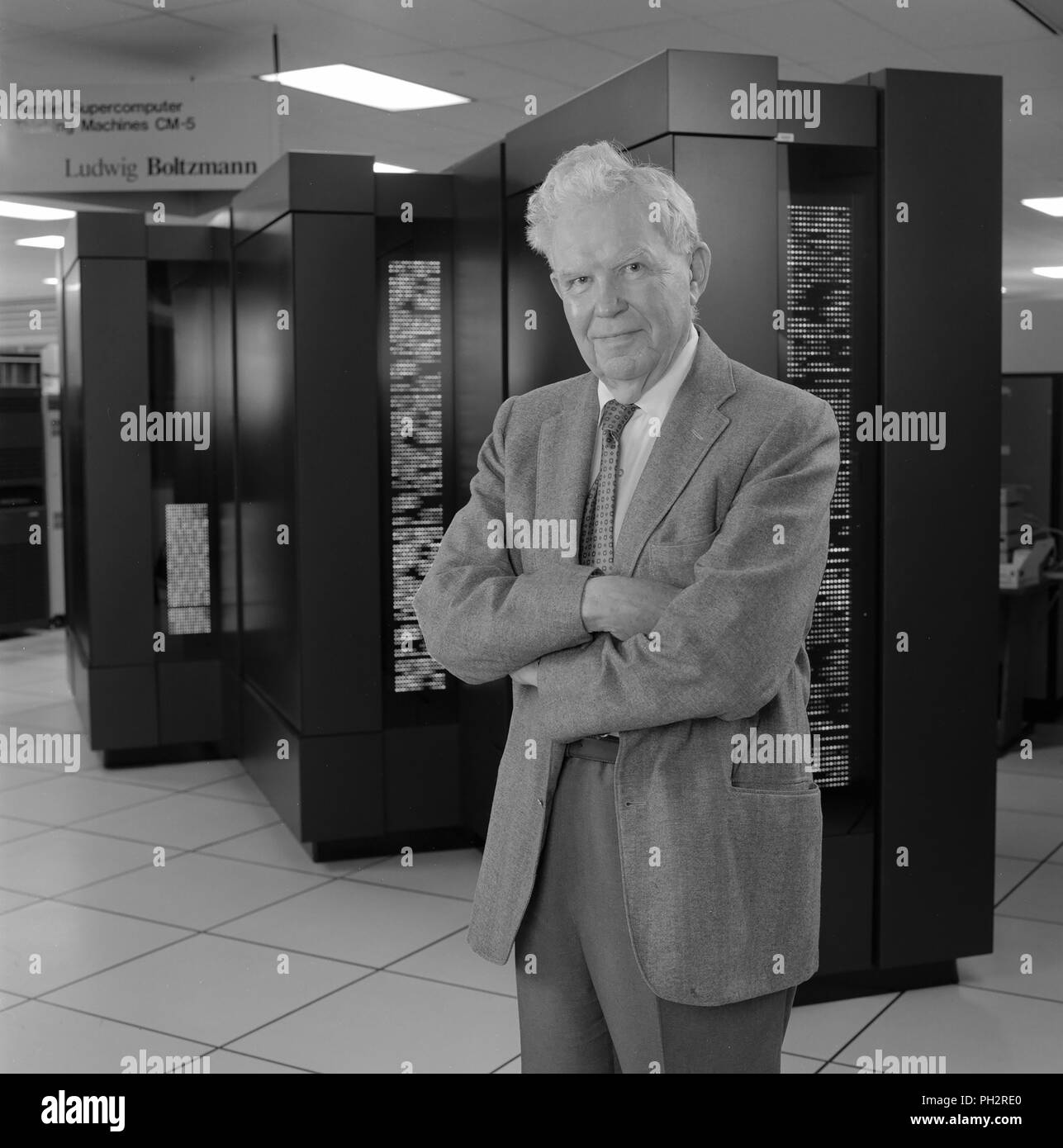 Black and white photograph of Harvey Lomax standing, in three-quarter view, in front of a CM-5 (Connection Machine-5) a massively parallel supercomputer, located in the NAS Facility N-258, photographed in honor of 50 years of service, in the Silicon Valley, Mountain View, California, May 25, 1994. Courtesy Internet Archive/NASA Ames. () Stock Photo