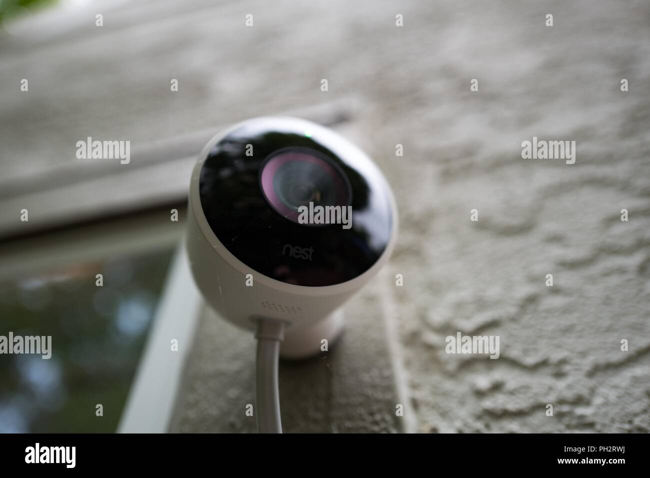 Close-up of weatherproof outdoor Nest home surveillance camera from Google Inc installed in a smart home in San Ramon, California, August 21, 2018. () Stock Photo