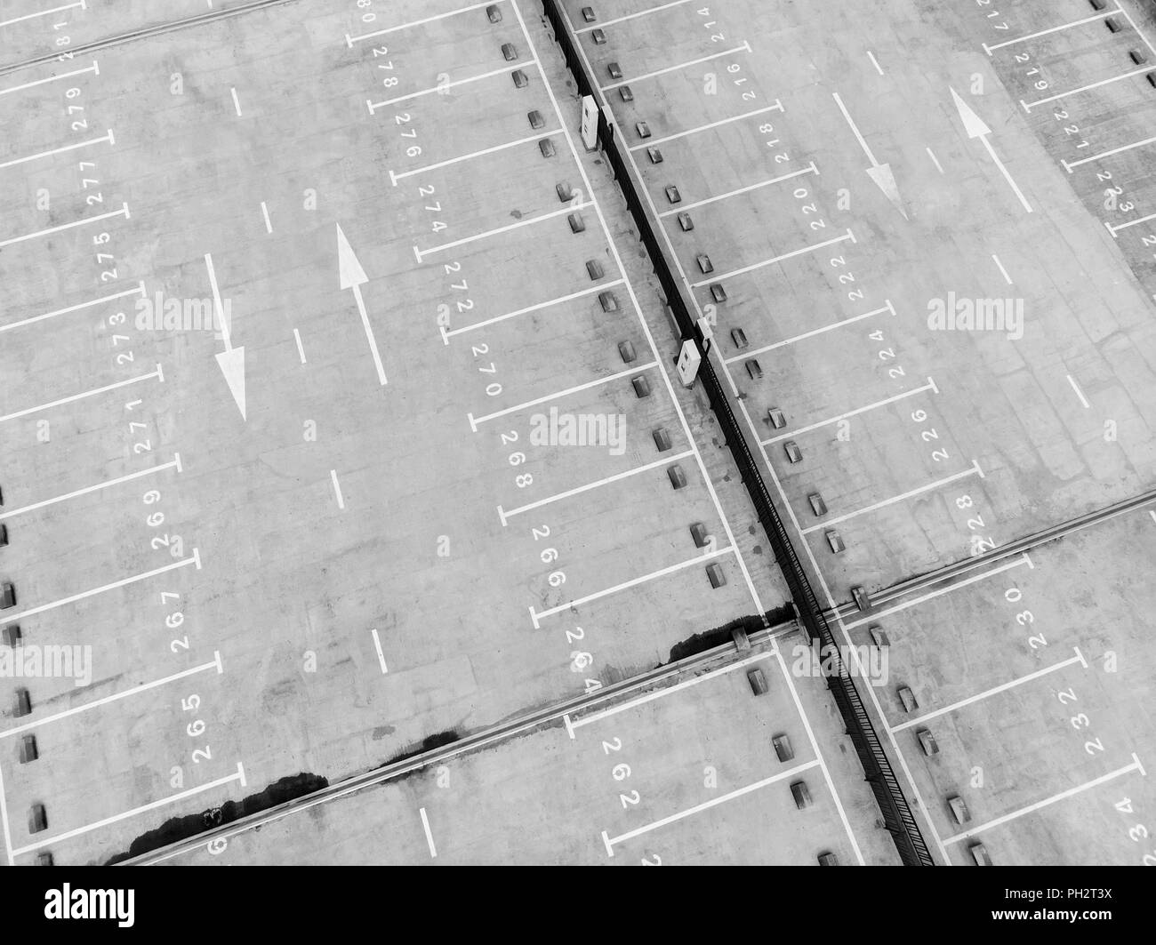 white marking lines and numbers on surface of empty parking lot, view from above Stock Photo