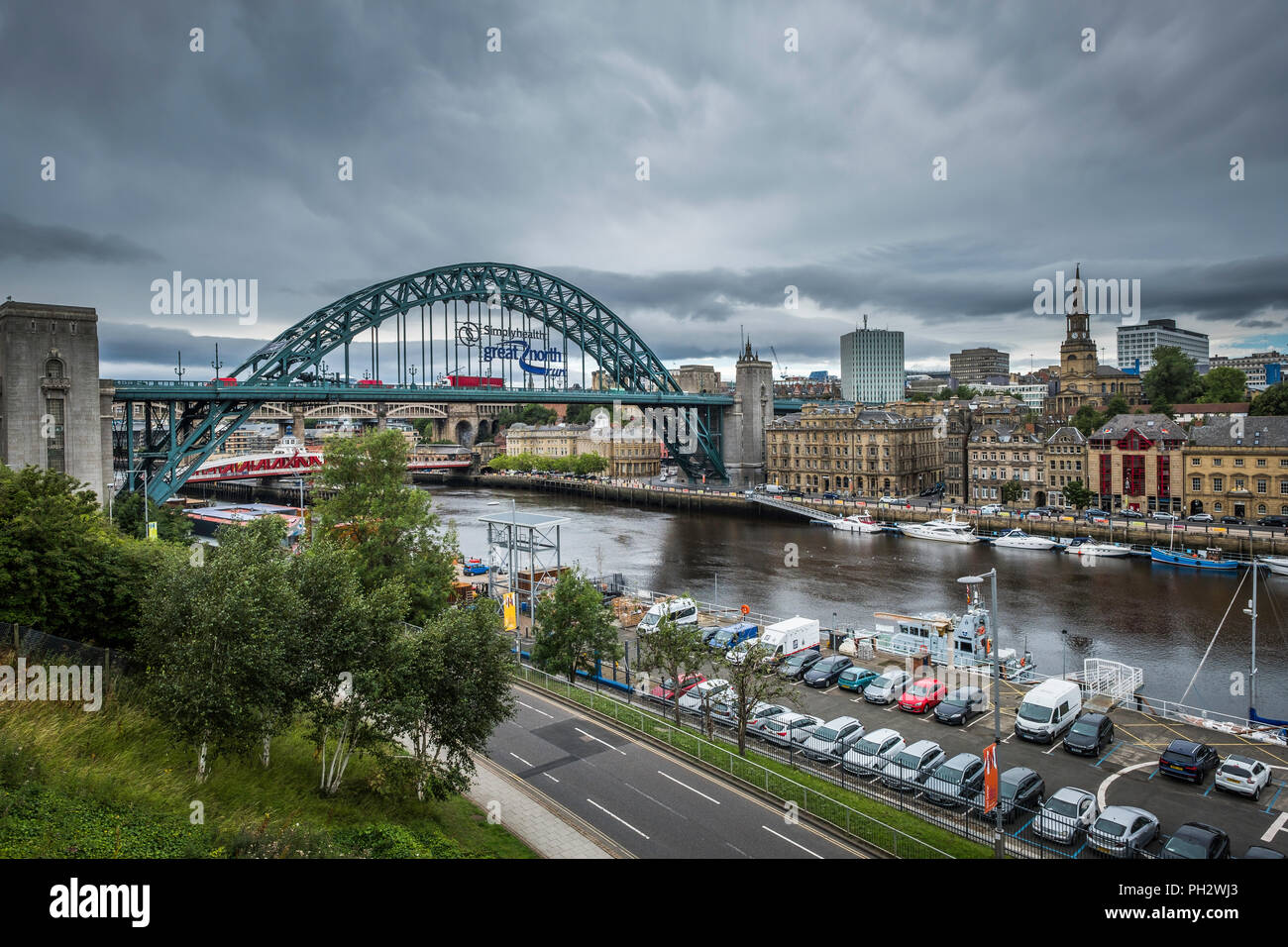 View of Newcastle with the Tyne Bridge carrying an advert for the Great North Run. Stock Photo