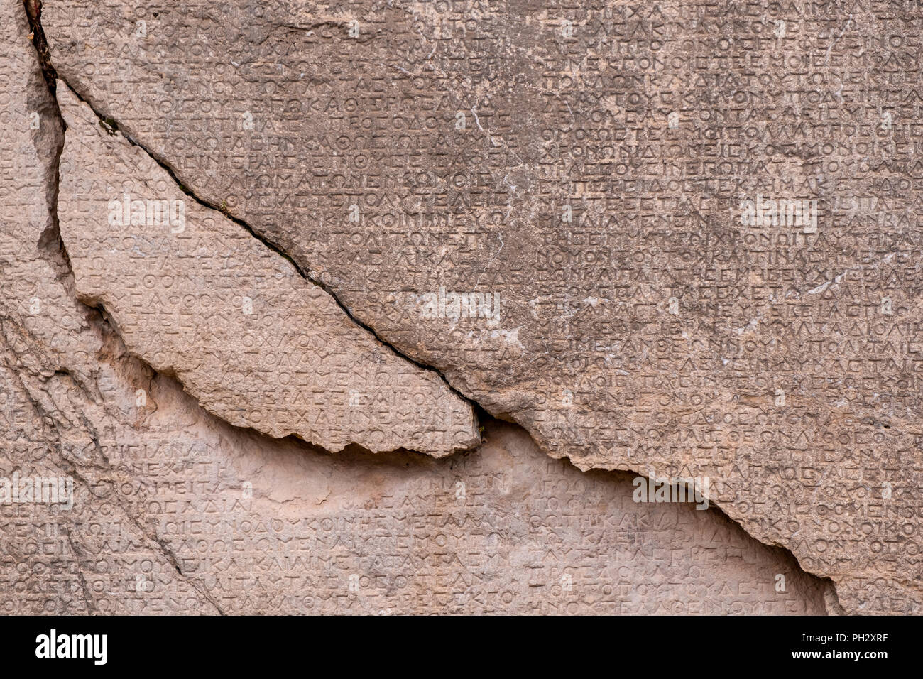 ancient Greek writing chiseled on stone Stock Photo Alamy