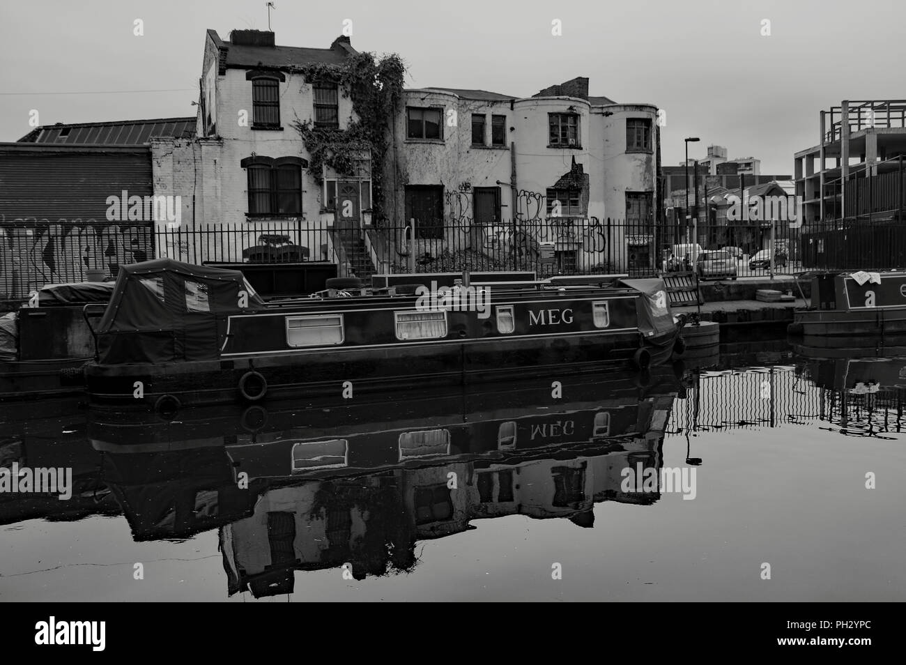 Canal boat moored on Regents canal in Haggerston area of London nearby Bethnal Green Stock Photo