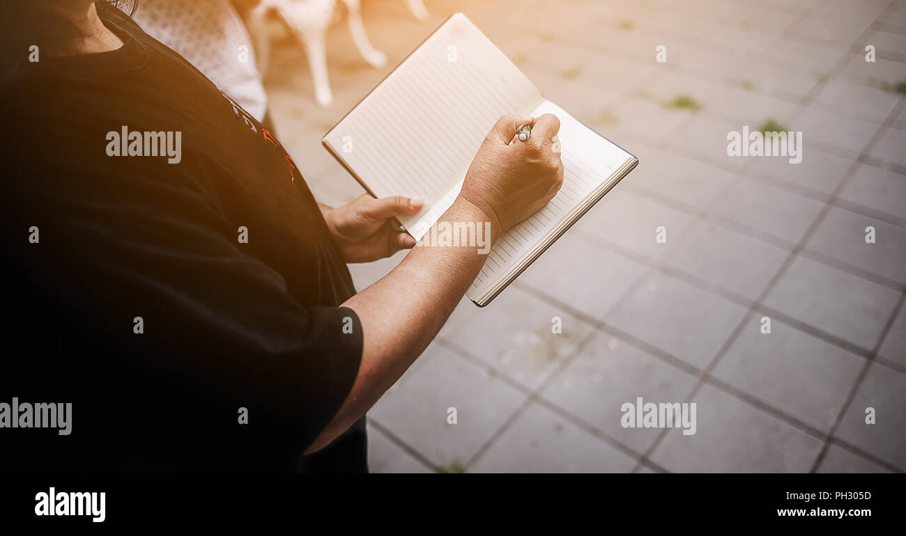Note taking Notebooks for teaching Remember to forget about things. With our own hands Stock Photo