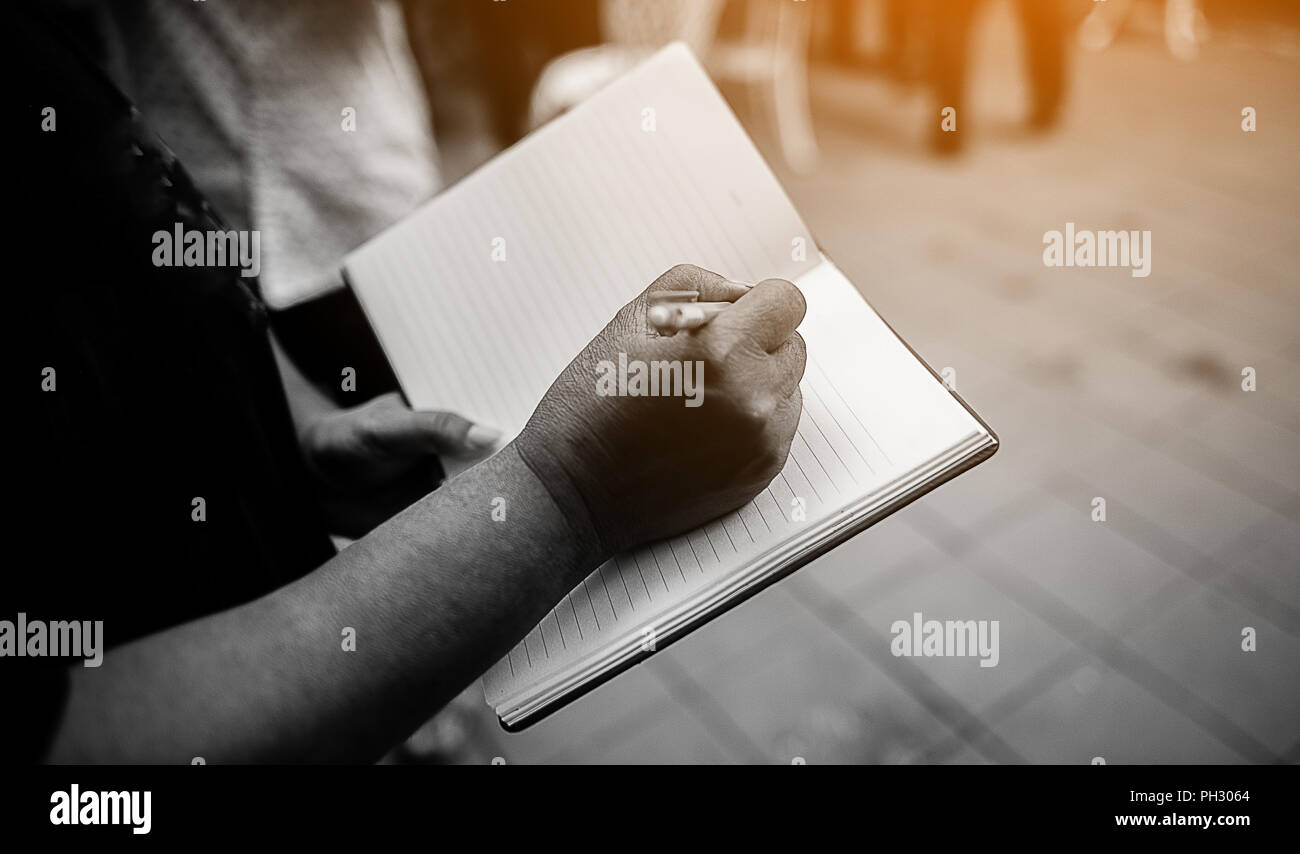Note taking Notebooks for teaching Remember to forget about things. With our own hands Stock Photo