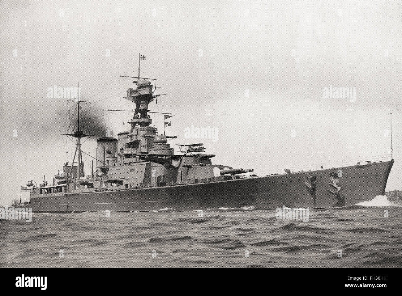 HMS Hood, the largest and last battle cruiser of the British Royal Navy, seen here carrying an airplane on the forward turret.  From The Book of Ships, published c.1920. Stock Photo