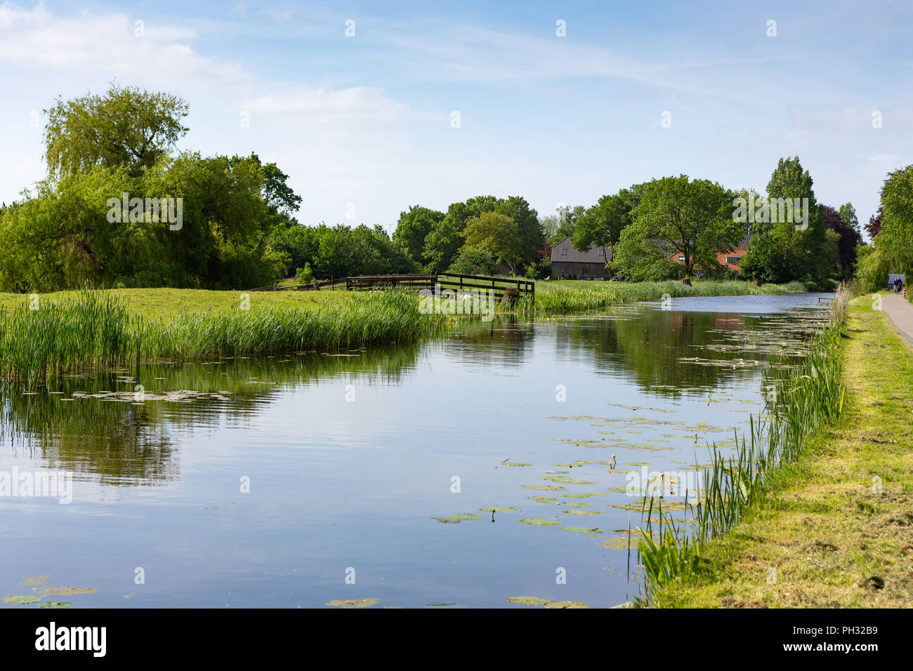 Farmhouse on the water in the Dutch village of Nieuwe Wetering in The Netherlands Stock Photo