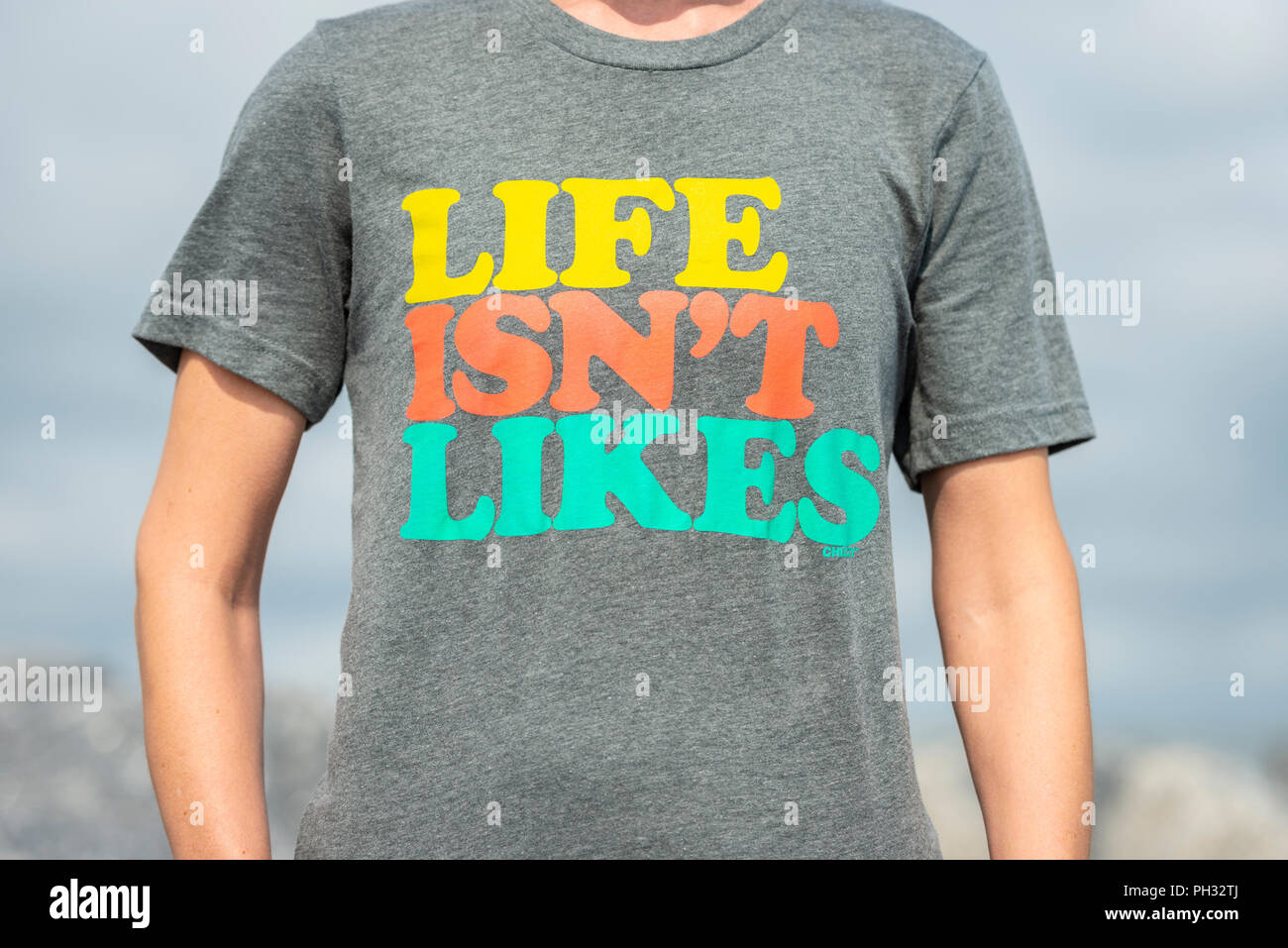 T shirt with slogan 'Life isn't likes' on the front. Stock Photo