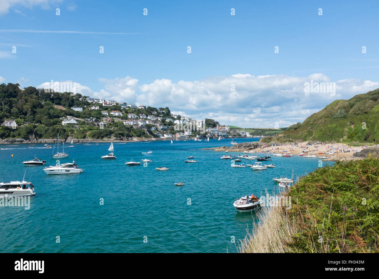 Pleasure boats on the Salcombe Estuary on a warm sunny late summer afternoon Stock Photo