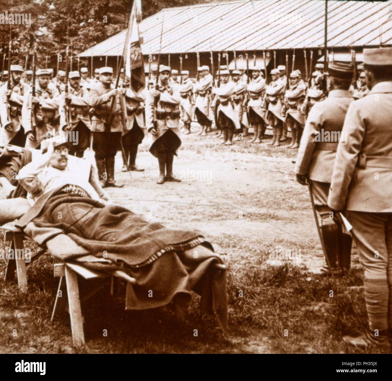 Wounded officer salutes the flag, c1914-c1918. Artist: Unknown. Stock Photo