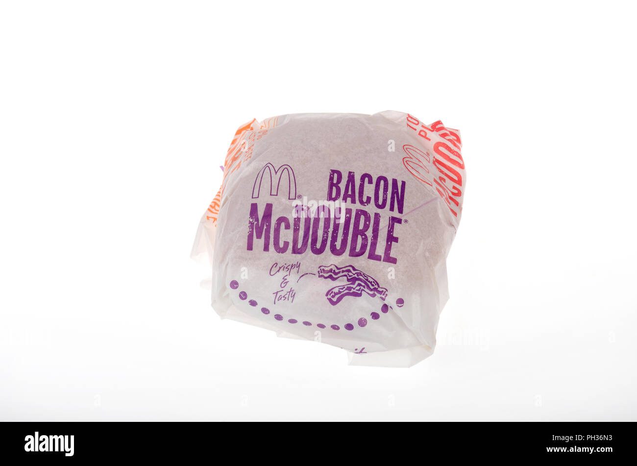 McDonald's Bacon McDouble cheeseburger in wrapper Stock Photo