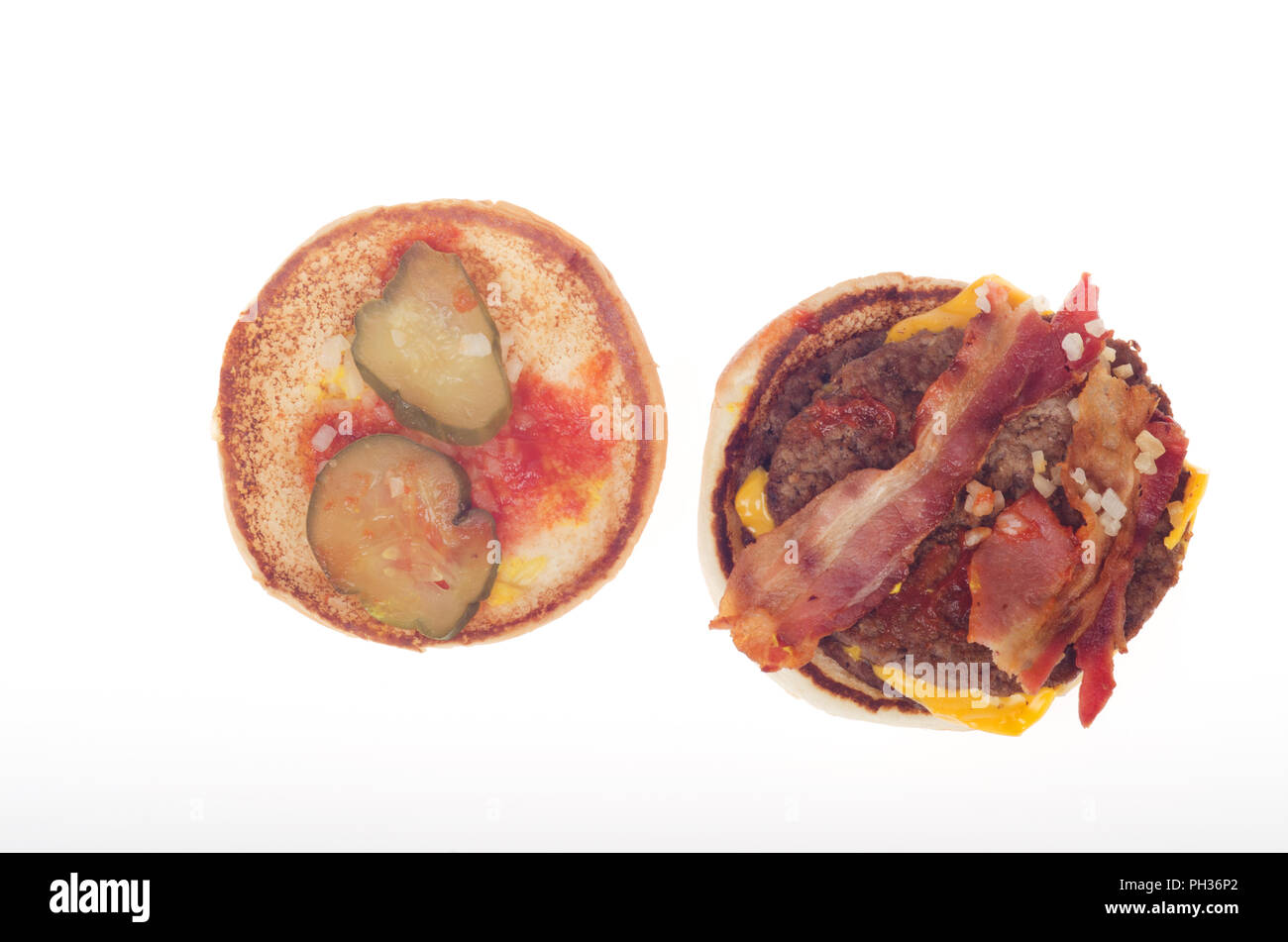 McDonalds Bacon McDouble Cheeseburger open showing bacon, burgers, pickles, onions,  ketchup and cheese Stock Photo
