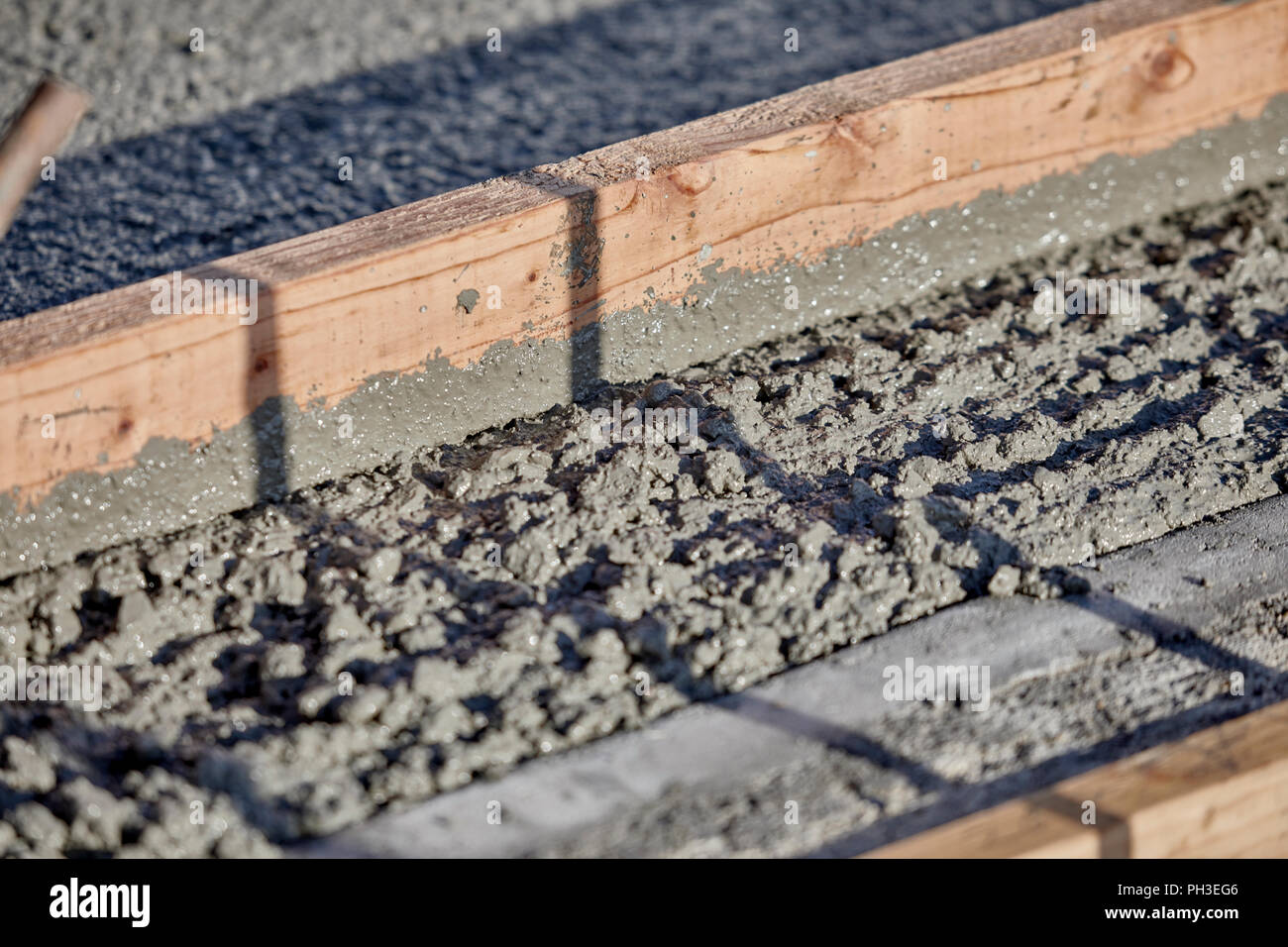 Close up of wet cement being leveled Stock Photo Alamy