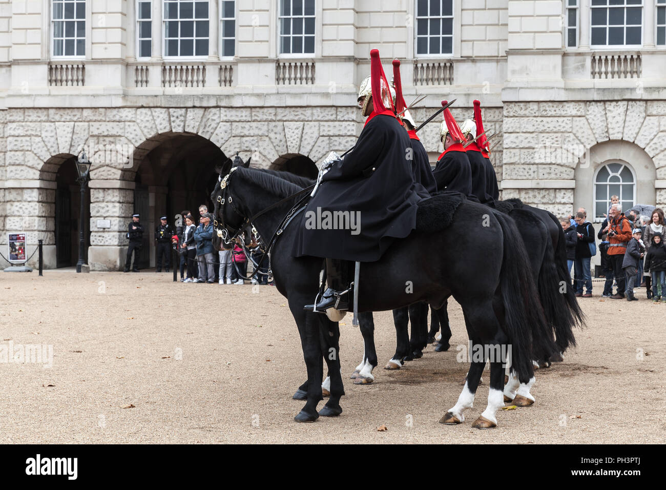 London, United Kingdom - October 29, 2017: Guards near Horse Guards of Whitehall in central London. Tourists watch the ceremony Stock Photo