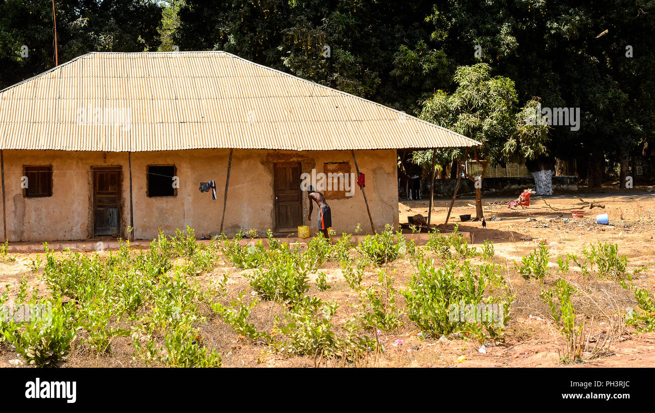 ROAD TO BISSAU, GUINEA B. MAY 1, 2017 Unidentified local man stands